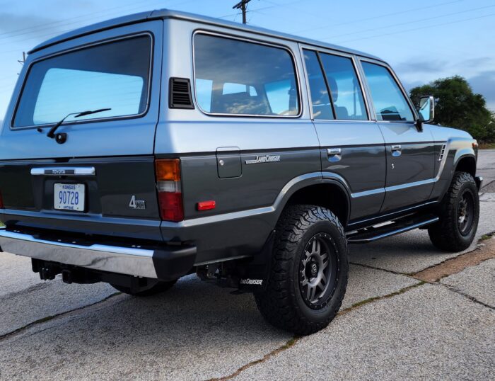 1989 Toyota FJ62 Land Cruiser two-tone rear view with custom bumper