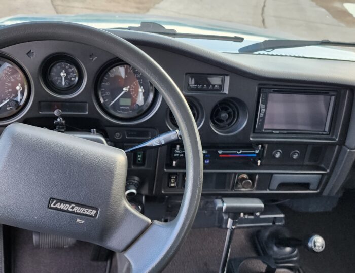 1989 FJ62 Land Cruiser dashboard with SpeedHut cluster and head unit