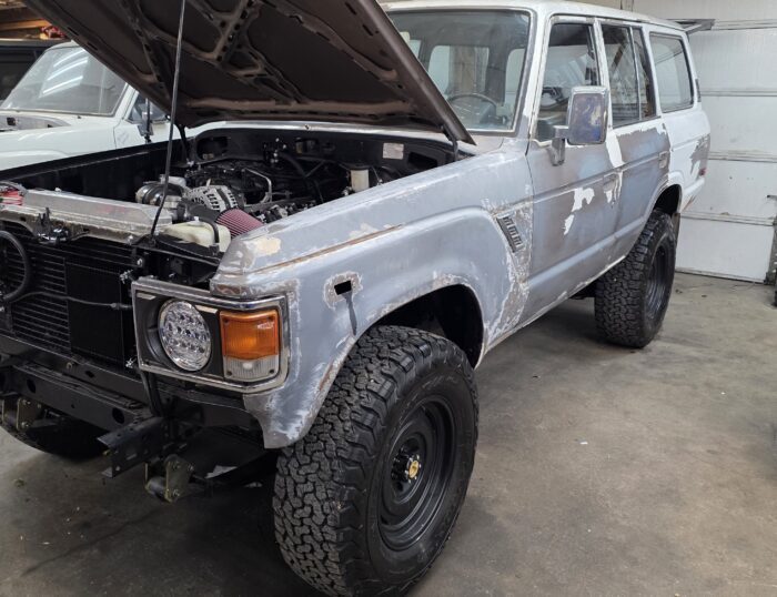 Front fender view of 1987 Toyota Land Cruiser FJ60 before paint and restoration