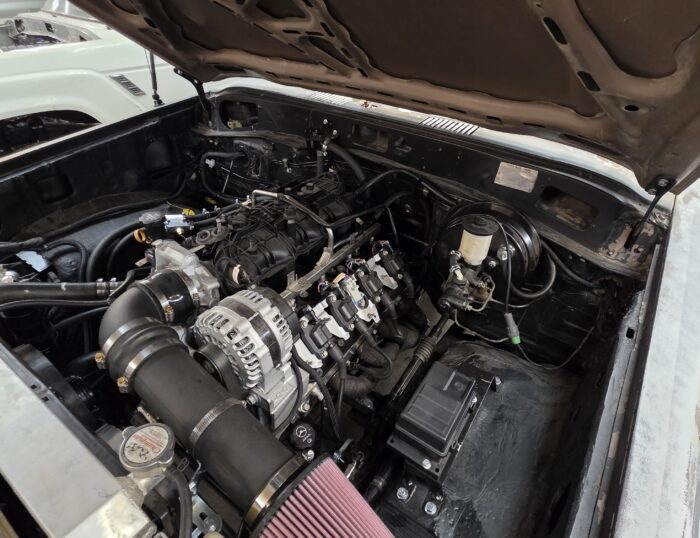 LS3 V8 5.3 engine swap installed in a Toyota Land Cruiser FJ60 engine bay at Land Cruiser Restorations in Belle Plaine, Kansas