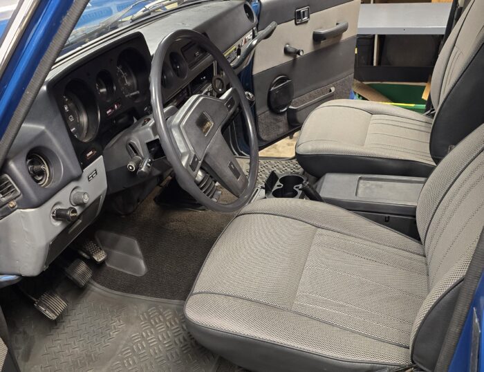 FJ60 Land Cruiser interior with grey and black seat covers