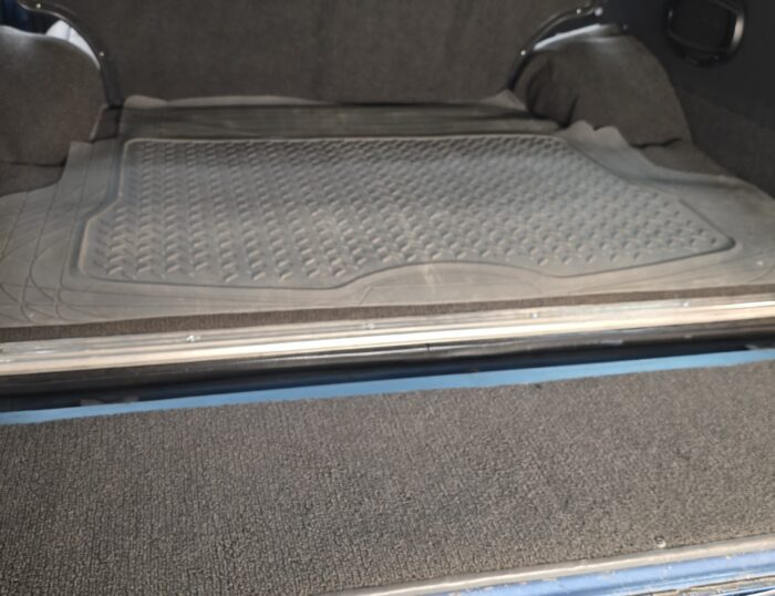 Restored FJ60 Land Cruiser cargo area with rubber mat